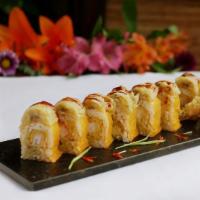 Banana Roll · Tempura shrimp and banana wrapped in soy paper, topped with tempura banana and eel sauce.