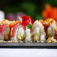 Beauty & the Beast Roll · Inside: shrimp tempura, cream cheese and avocado, outside:tuna, eel, tempura crumbs and tobi...