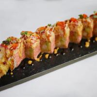 Pink Lady Roll · Shrimp tempura, avocado, cucumber and spicy tuna wrapped in pink soy paper, topped with spic...
