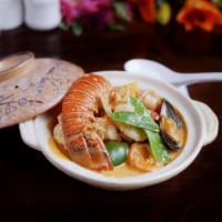 Thai Curry Seafood in Clay Pot · Shrimp, scallop, mussel and lobster with mixed vegetables in a rich and creamy scrumptious c...
