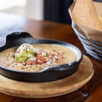 Green Chili Queso · Queso blanco, roasted green chili, pico de gallo, house-made tortilla chips. Add ons and ext...