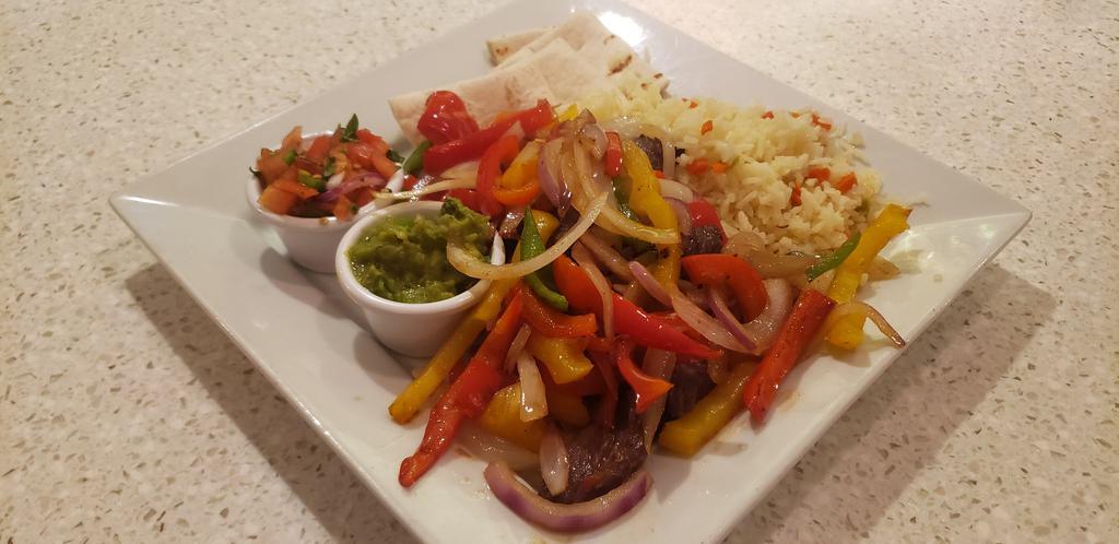 Fajitas · Sautéed Onion & Pepper, Flour Tortillas, Pico de Gallo, Guacamole, & Rice