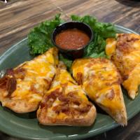 Tavern Dunkers · 4 strips of ciabatta, glazed with garlic butter, topped with shredded cheese and toasted. Se...