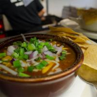 Northwoods Chili · A hearty blend of beef, tomato, onion, black and pinto beans – spiced just right! Served wit...