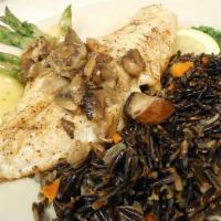 Northwoods Dinner · Grilled walleye on a bedof long grain Minnesota wild rice with sauteed mushrooms, fresh-gril...