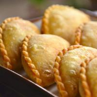 Curry Puffs · Spicy potatoes, onion and curry spices. 