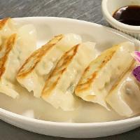 Chicken Dumpling · With soy vinaigrette.