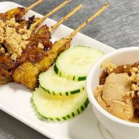 Satay Combo · Satay chicken and crispy satay tofu puff with spicy peanut sauce.