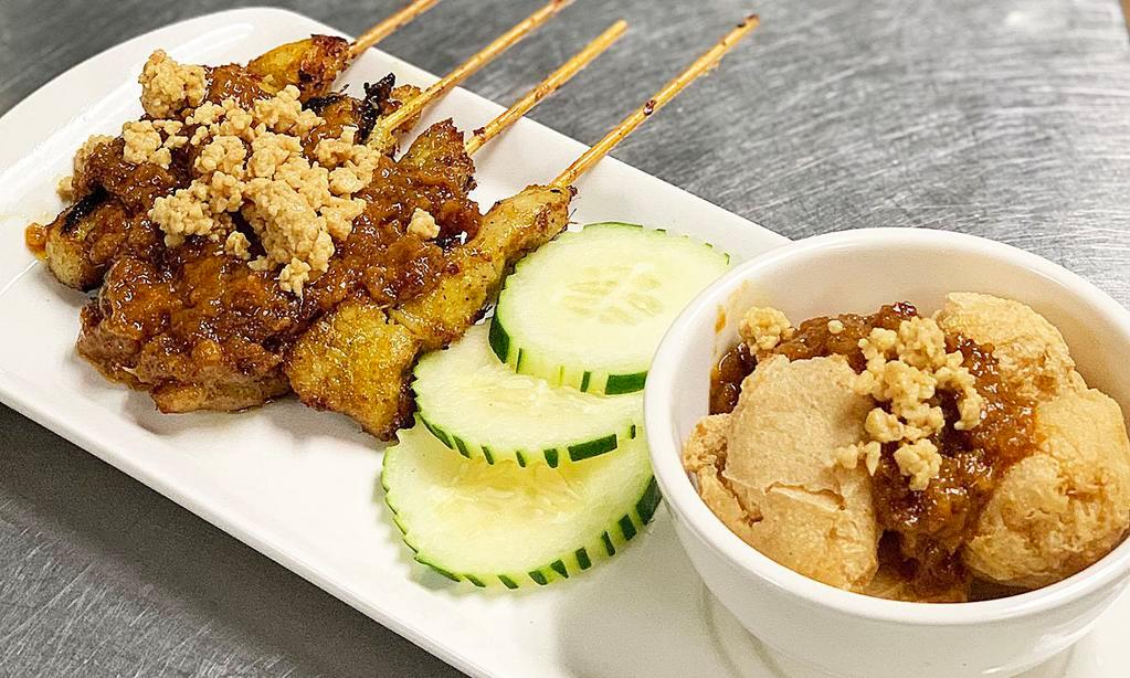 Satay Combo · Satay chicken and crispy satay tofu puff with spicy peanut sauce.