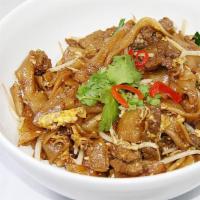 Char Kueh Teow · Flat broad noodles with chives, bean sprouts, eggs and soy sauce with homemade chili sauce. 