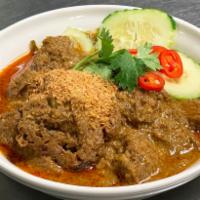 Rendang Beef · Simmered until dry with exotic spices, lemongrass, lime leaves and grated coconut with thick...