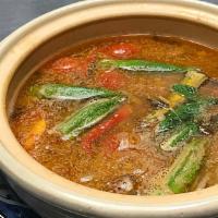 Assam Pedas ·  choice of seafood protein with okra, tomatoes, and bamboo shoots in tamarind broth.
