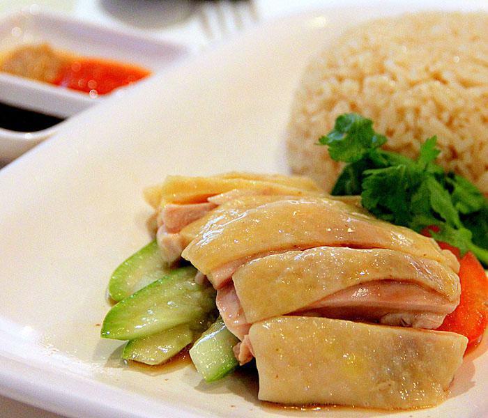Steamed Hainanese Chicken (with Bones) · Garlic, chili sauce, sesame oil, soy sauce, hakka cilantro and served with chicken-flavored rice.