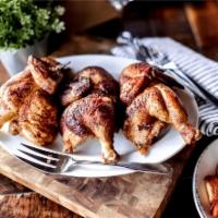 Rotisserie Chicken Family · 1 and 1/2 whole signature rotisserie chickens, house salad with choice of dressing served on...