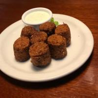 Tater Kegs · Jumbo tater tots stuffed with bacon and cheddar cheese, served with side of ranch dressing.