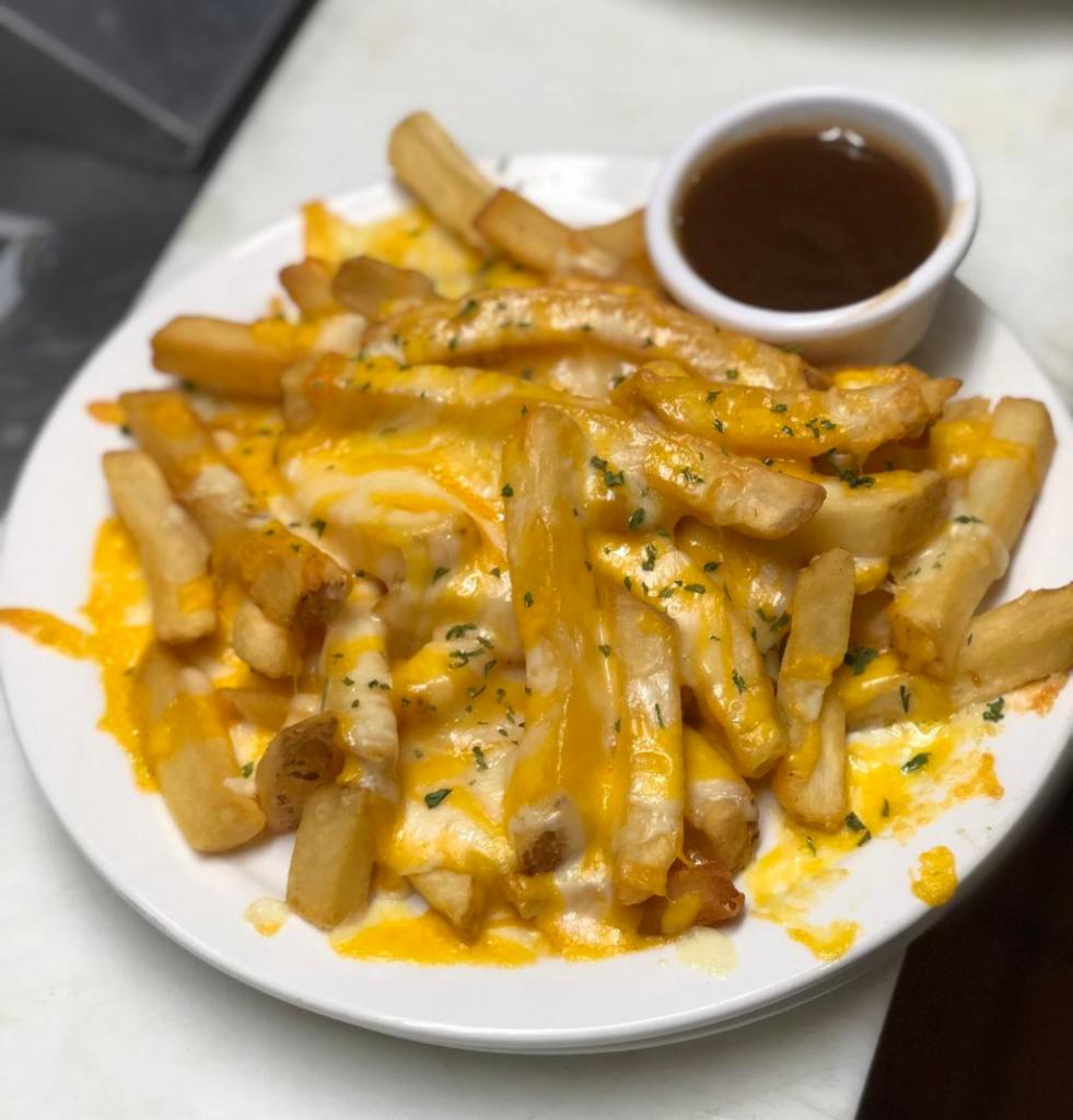 Cheese Fries · House fries topped with cheddar Jack cheese and served with gravy for dipping delight Add bacon or Chili for an additional charge.