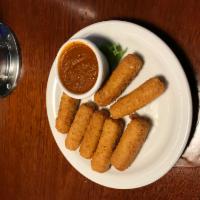 Mozzarella Sticks · Mozzarella dipped in bread crumbs and fried. Served with homemade marinara sauce.
