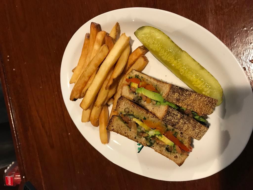 Rocado Sandwich · Toasted multigrain panini with avocado, roasted red peppers, pico de gallo, and fresh pesto. Vegan friendly.