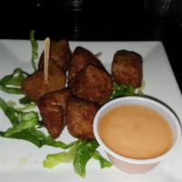 LZ Blackened Tuna Bites · Fried and served over lettuce with Dominican coconut sauce on the side.