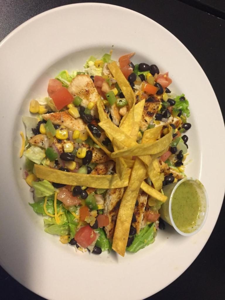 Santa fe Salad · A combination of grilled chicken, black bean, corn and bell pepper salsa, tomato, lettuce, shredded cheddar cheese and tortilla strips dressed with LZ's cilantro mango lime dressing.