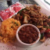 Fajitas · Served with grilled peppers, onions, rice, tomatoes, beans, pico de gallo with flour or corn...