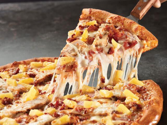 Hawaiian Chicken Pizza · Cheese, ham, grilled chicken, bacon, pineapple, sprinkling of extra cheese.
