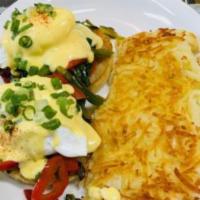 Veggie Egg Benedict · 2 poached eggs, served with sauteed spinach, tomato, and mushroom on a grilled English muffi...
