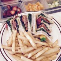 Club House Sandwich · With bacon, thinly sliced turkey breast, lettuce, tomato, and mayonnaise on toasted white br...