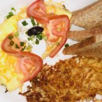 Vegetable Omelette · 3 egg omelette filled with grilled onions, mushrooms, bell pepper, mixed jack, and cheddar c...