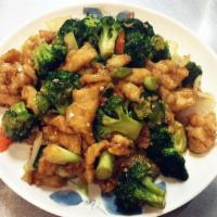 21. Chicken with Broccoli · Sliced white meat chicken with broccoli, carrots and onions stir fried in brown sauce.