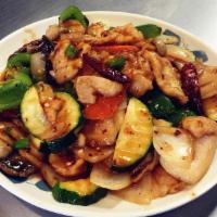 30. Chicken in Hot Garlic Sauce · Sliced white meat chicken with carrots, mushrooms, diced bell pepper zucchini and onion stir...