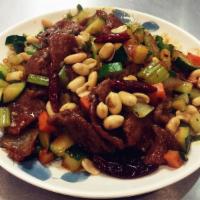 39. Kung Pao Beef · Tender sliced beef with zucchini, celery, carrots stir fried in our spicy kung pao sauce top...