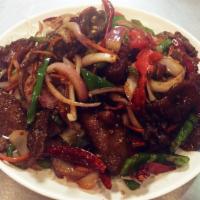 40. Mongolian Beef · Tender sliced beef with bell pepper, onion and carrots stir fried in a spicy Mongolian sauce...
