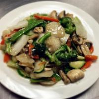 67. Sauteed Garden Vegetables · An assortment of vegetables, (broccoli, zucchini, carrots, Napa cabbage, baby corn and water...