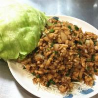 C3. Chicken Lettuce Wraps · Minced chicken with mushrooms, water chestnuts and green onions wok stir fried in a house sa...