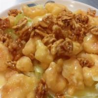 C5. Honey Walnut Shrimp · Crispy shrimp over lettuce glazed with honey walnut sauce topped with walnut.