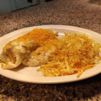 Breakfast Burrito · Ham, bacon or sausage smothered in red or green chili or country gravy and served with potat...