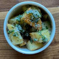 Parmesan Roasted Potatoes · Diced potatoes finished with freshly shaved Parmesan. Gluten free.
