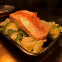 Salmon al Vapor · Steamed salmon cooked in a bamboo steamer, seasoned with Mexican spices and served with seas...
