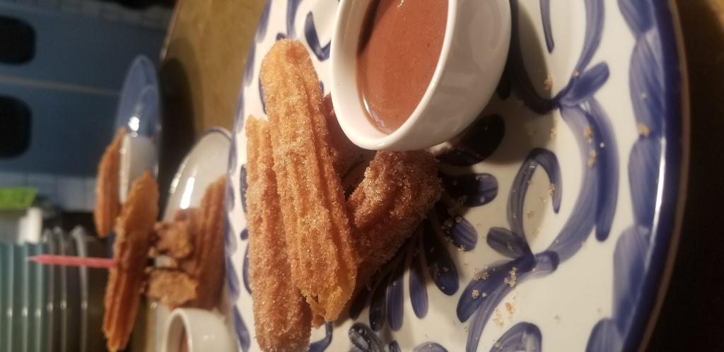 Churritos con Chocolate · Traditional churros, served with our signature chocolate abuelita sauce