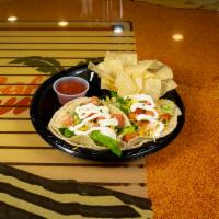 Rumba Taco · Fresh corn or flour tortilla served with your choice of meat and topped with cheese, lettuce...