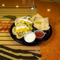 Tropical Taco · Fresh corn or flour tortilla served with your choice of meat and topped with cheese, lettuce...