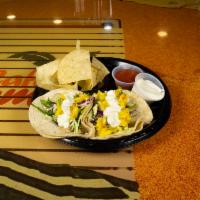 Baja Tacos · Fresh corn or flour tortilla served with your choice of sauteed shrimp or white fish filet a...