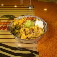 Nachos · Tortilla chips topped with your choice of meat, beans, melted cheddar and Monterey Jack chee...