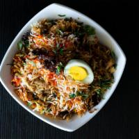 Chicken Dum Biryani · Aromatic rice, chicken, fragrant spices, and caramelized onions. Spicy.
