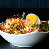 Mutton Dum Biryani · Aromatic rice, goat, fragrant spices, and caramelized onions. 
