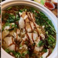 38. Pho Ga · Chicken rice noodle soup. Tender white chicken slices in a rich stock with sweet onion and c...