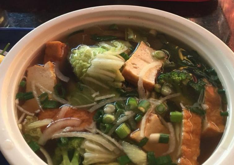 7. Canh Chay Vegetable Soup · Rice noodles, with fried tofu, carrots, broccoli, and napa cabbage. Served with Asian greens.