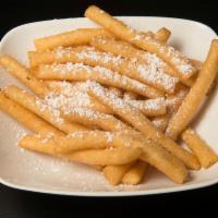 Sopapillas · 5 pieces of deep fried homemade sweet flour tortilla, topped with cinnamon and honey.