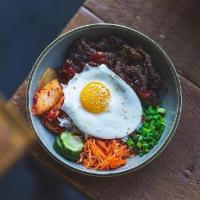 Korean BBQ Bowl · Korean BBQ short rib, rice, homemade kimchi, pickled carrots and radish, scallions, sunny si...
